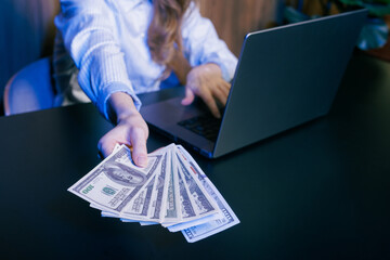 Businesswoman offering cash online, financial transaction, digital money exchange, investment, and...