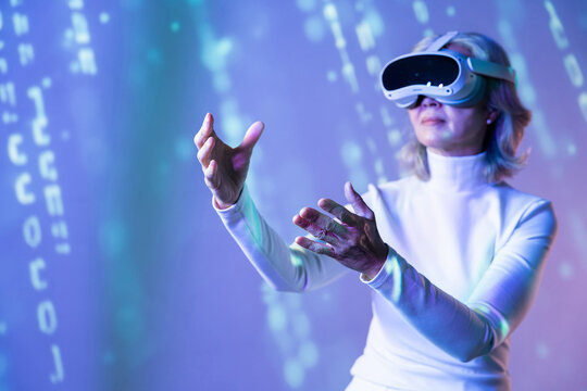 Elderly asian woman exploring the metaverse with VR headset