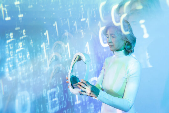 Elderly asian woman exploring the virtual metaverse