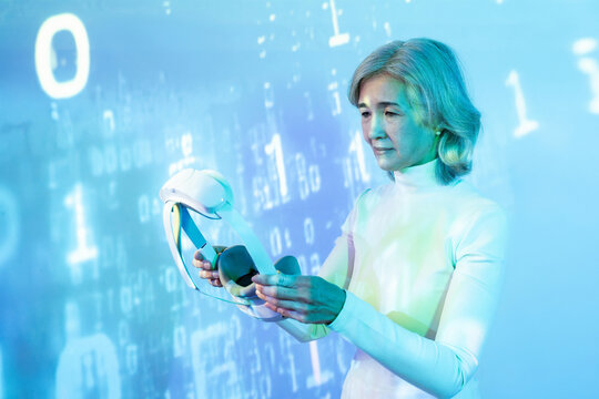 Elderly asian woman exploring virtual reality