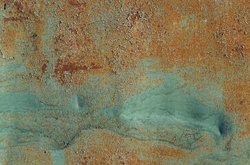 Rusty metallic texture with a blend of blue and orange hues creates an abstract background