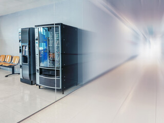 Vending machines in a modern corridor setting with seats
