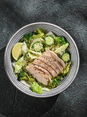 green salad with chicken, cucumber and broccoli