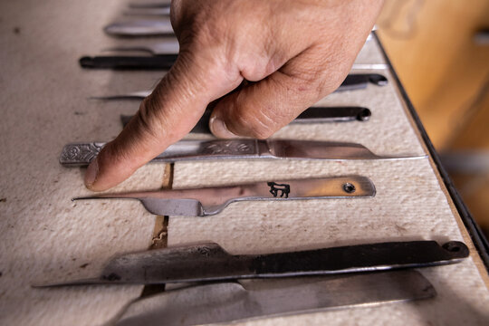 Iranian master restores carpets using traditional tools