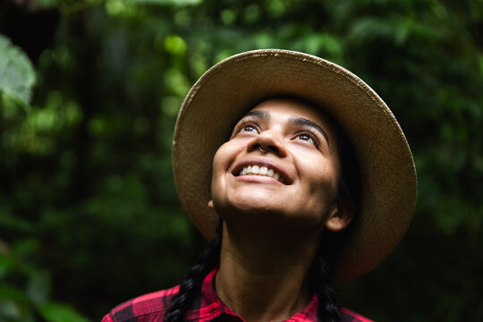 Young woman exploring lush Choco Andino rainforest