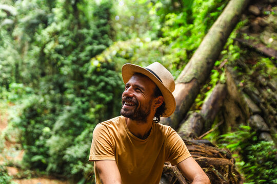 Man enjoying lush greenery in Choco Andino rainforest
