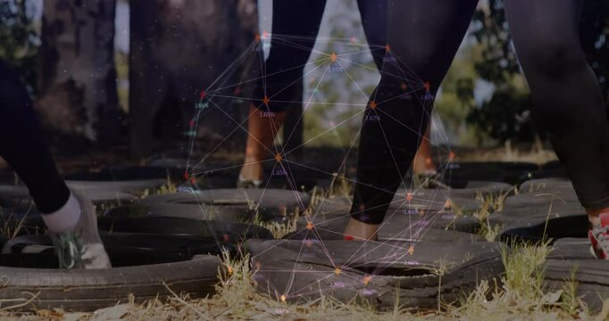 People running through tire obstacle with network connections animation overlay