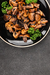Mushrooms fried champignons vegetables dish fresh gourmet food background on the table rustic food top view copy space food