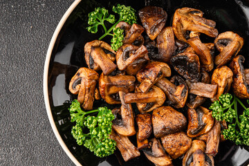 Mushrooms fried champignons vegetables dish fresh gourmet food background on the table rustic food top view copy space food