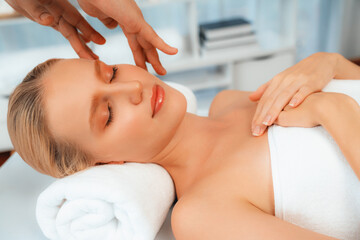 Caucasian woman enjoying relaxing anti-stress head massage and pampering facial beauty skin...