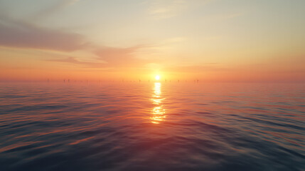 Obraz premium Offshore wind farm with turbines visible on the horizon, stretching out across the ocean with the sun setting in the distance.