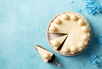 English Easter simnel cake. Blue background. Copy space. Top view.