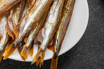 smoked capelin fish sprat vegetables dish fresh gourmet food background on table rustic food top...