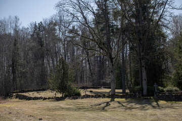 old partially ruined wall made of granite boulder rocks and field stones