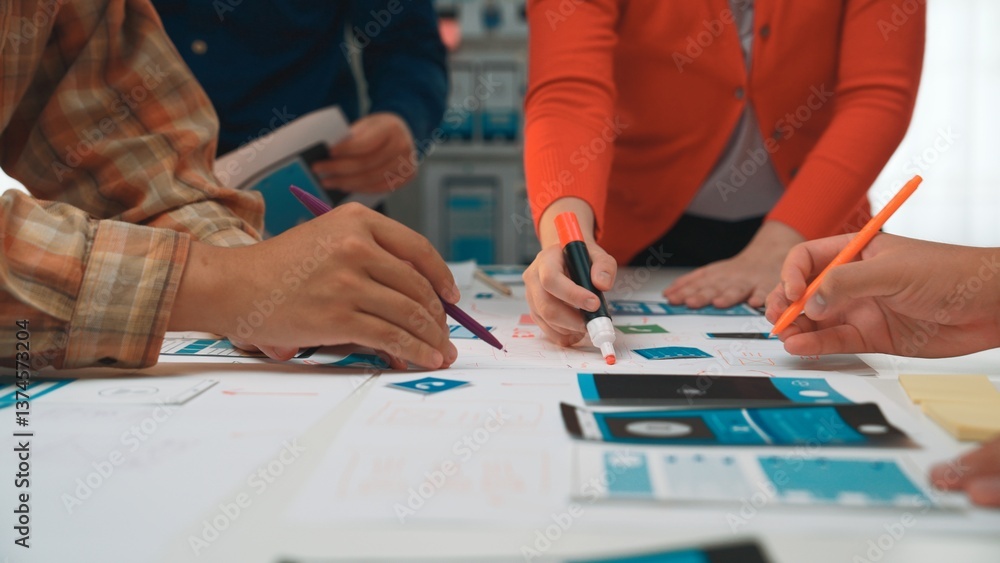 Poster a close-up view of hands engaged in a creative design project, using colorful markers and paper in a