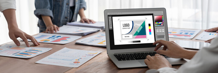 Graphic designer software for modern design of web page and commercial brisk ads showing on the...