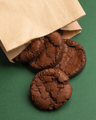 Chocolate cookies on green background