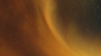 Abstract background showing blurred shades of gold brown and black creating a soft flowing effect