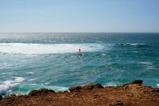 Wind serfing and blue ocean in the background. Summer, Travel, Portugal vacation.