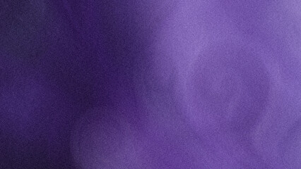 A blurred abstract background featuring shades of purple and dark colors creating a soft and dreamy effect