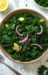Bowl with vibrant kale salad, saut&eacute;ed garlic, sesame, and onion on wood