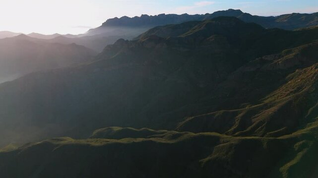 Experience breathtaking and stunning drone footage of the vibrant and picturesque Malibu mountains at sunset, beautifully capturing natures magnificent beauty in this unforgettable outdoor adventure