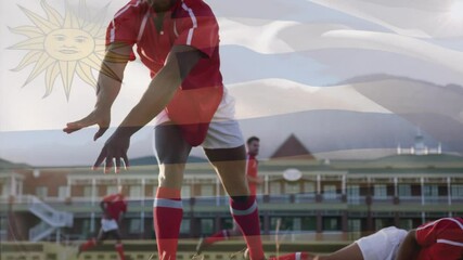 Rugby players tackling with Uruguay flag animation overlaying action scene - Powered by Adobe