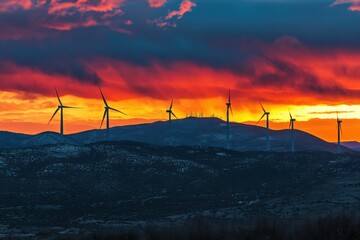 Free photo of a sunny landscape with windmills