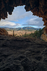 View of the exit from the cave in the mountains