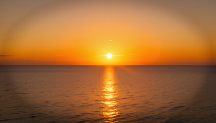 Obraz premium Serene sunset over calm ocean waters during twilight 