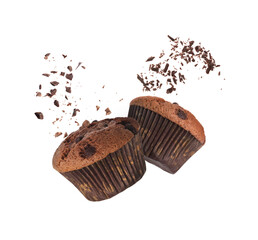 Yummy chocolate chip muffins in air on white background
