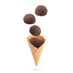 Ice cream scoops and waffle cone in air on white background