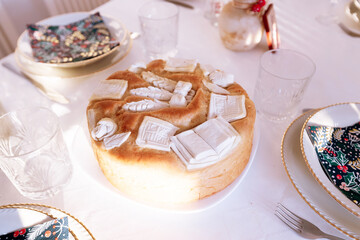 Handcrafted Festive Bread With Intricate Dough Decorations And Cultural Symbolism