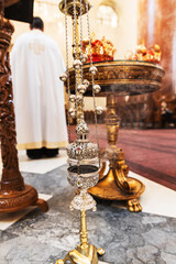 Close-up of an Ornate Incense Burner in an Orthodox Church, With Intricate Designs and Smoke Rising From It