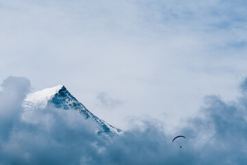 Paraglider above the clouds