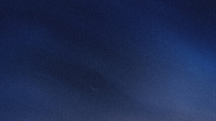 A blurry dark blue abstract background with subtle gradients and soft light diffusion creating a calming effect