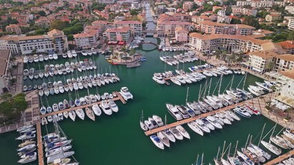 Aerial view of yachts in a marina in Frejus, France shot with a drone