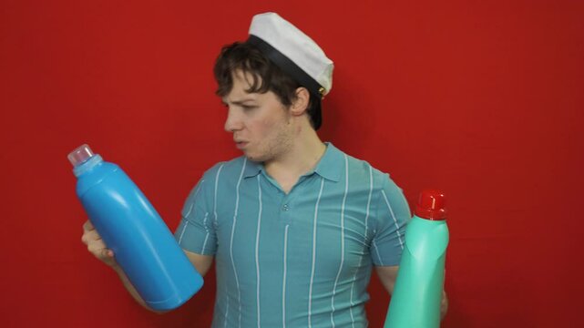 A man chooses a cleaning product for the premises.