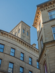 Tall 19th century neoclassical buildings in the Bradford Little Germany District looking upwards from a street corner