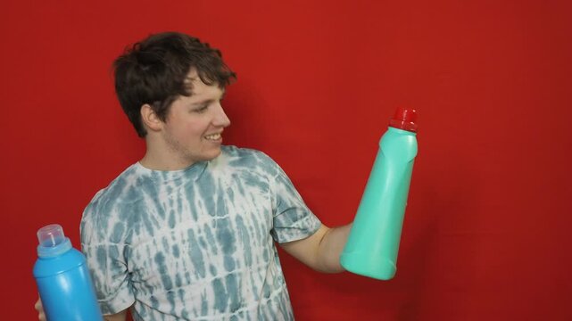 A man chooses a cleaning product for the premises.