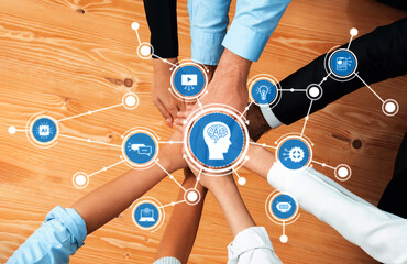 A vibrant meeting scene showcasing hands joining together around AI and technology icons on a...