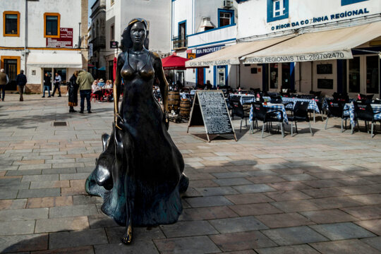 The statue of Moura Floripses, The. mythical temptress, sculptor Leonel Mourain, .Olh&aacute;o, Portugal.