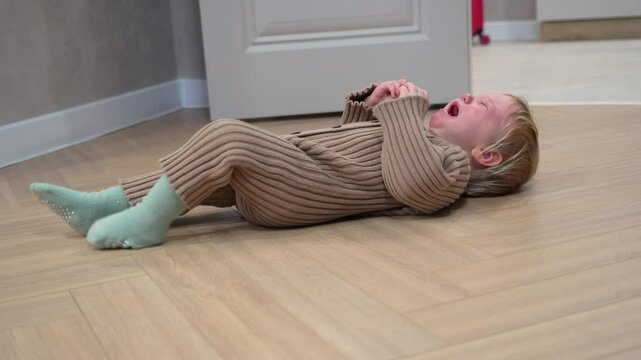Child experiences frustration and a tantrum, then transitions to a peaceful nap on the floor