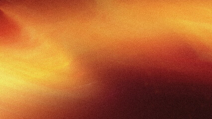 Abstract blurred background with warm colors showing a blend of orange yellow and red tones softly...