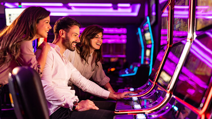 Friends Enjoying Slot Machines in a Vibrant Casino Environment