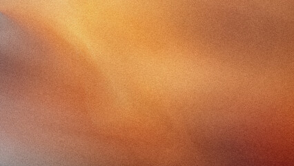 Abstract blurred background featuring warm tones of orange yellow and brown creating a soft gradient effect