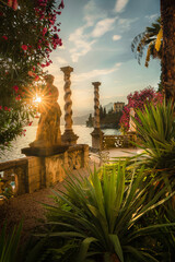 Villa Monastero, Varenna village. Beautiful sunset with clouds in Alps mountains. Epic blue lake near Milan, mountain, exotic garden, colorful flowers. Premium landscape from nature, Lombardy, Italy