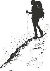 Fototapeta premium Silhouette of a hiker with a backpack trekking up a steep mountain trail.