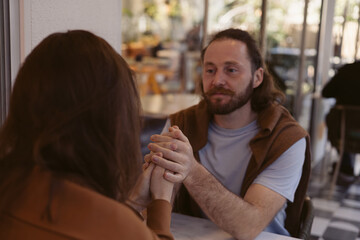 Couple enjoying a quiet moment together at a cafe during the afternoon