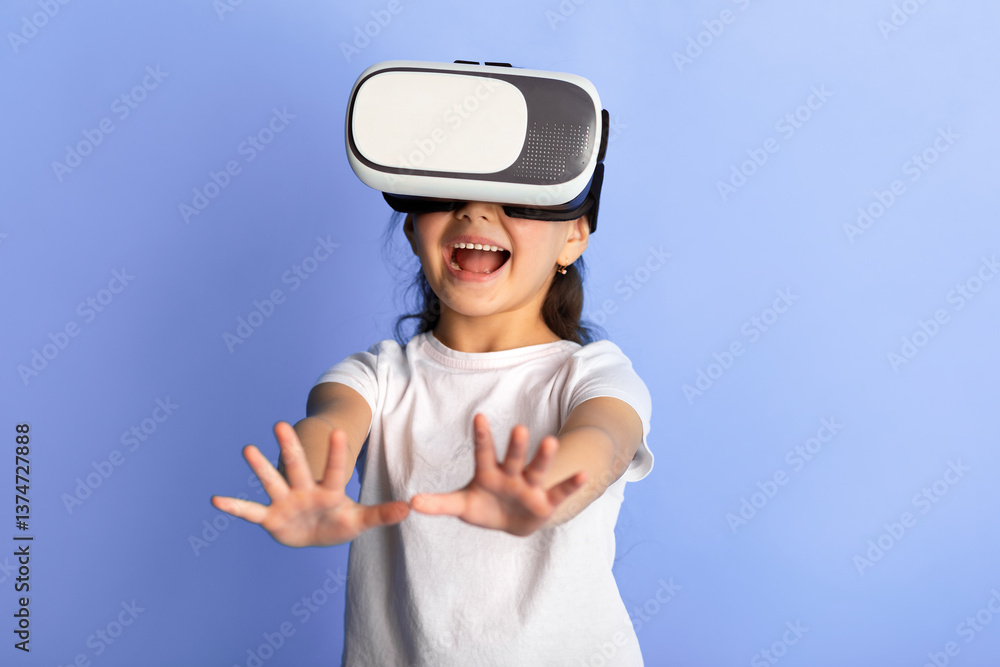 Aufkleber excited korean child using vr headset and experiencing virtual reality, blue studio background